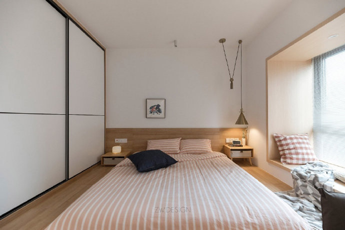 点击大图看下一张：日式三居室，营造简约纯粹的感觉
