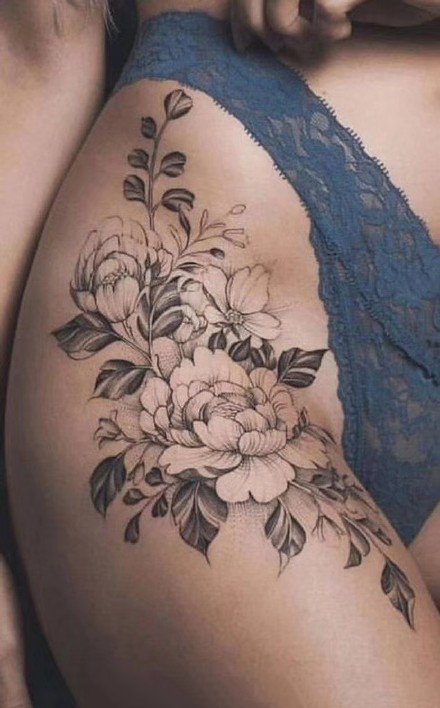 点击大图看下一张：一组性感的女生大腿花朵纹身图案