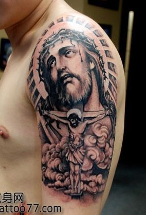 点击大图看下一张：大臂耶稣头像纹身图片