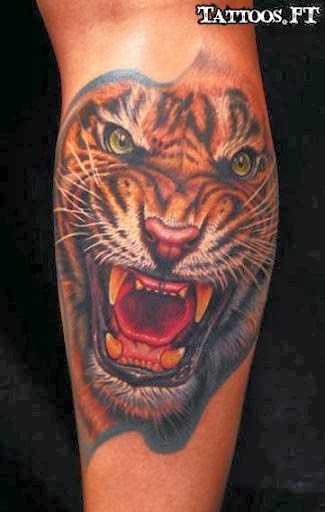 点击大图看下一张：小腿部霸气的老虎头像纹身图3
