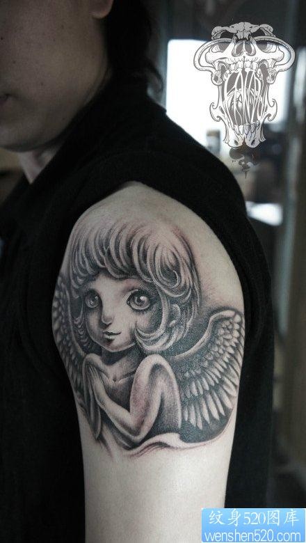 点击大图看下一张：男生手臂可爱的小天使纹身图片