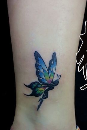 点击大图看下一张：女孩子喜欢的腿部蝴蝶精灵纹身图片