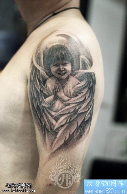点击大图看下一张：一款手臂漂亮的小天使纹身图案