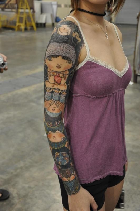 点击大图看下一张：女孩子的花臂纹身