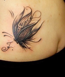 点击大图看下一张：女士手臂上唯美的蝴蝶图腾纹身图案