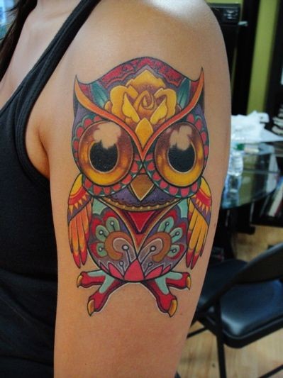 点击大图看下一张：手臂上非常可爱的大雁猫头鹰纹身