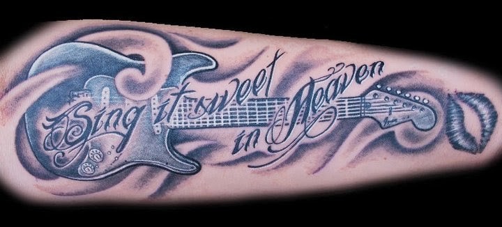 点击大图看下一张：手臂上帅气的吉他英文纹身