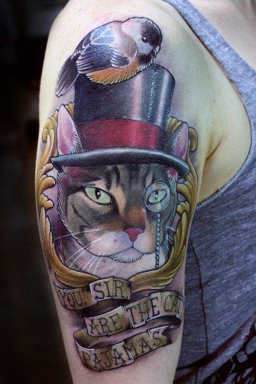点击大图看下一张：手臂上帅气的猫纹身