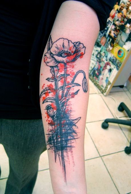 点击大图看下一张：手臂上好看的抽象花朵纹身
