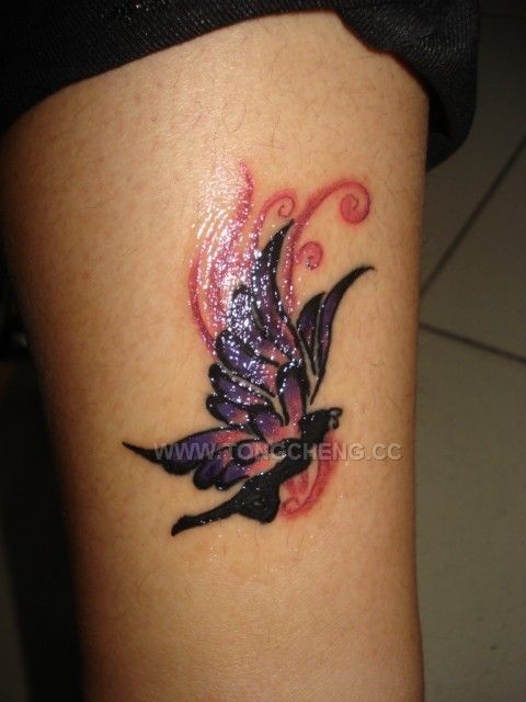 点击大图看下一张：手臂唯美纷飞蝴蝶精灵纹身图片
