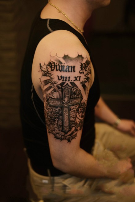 点击大图看下一张：创意花臂十字架手臂纹身图案