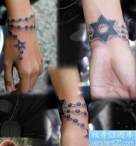 点击大图看下一张：手臂纹身图片：手臂五角星六芒星吊链纹身图片纹身作品