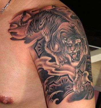 点击大图看下一张：老虎纹身图片：手臂下山虎纹身图片纹身作品