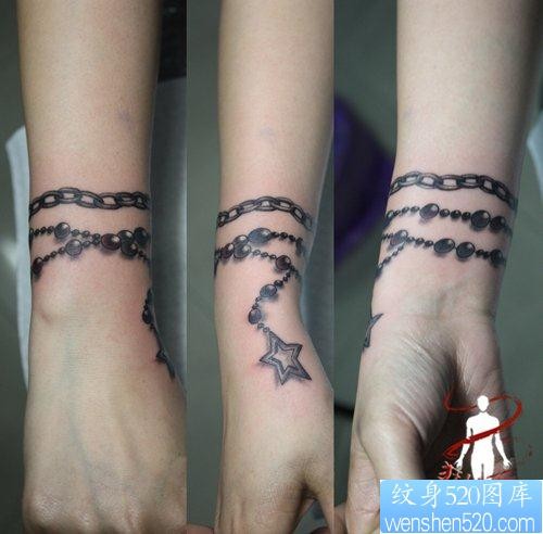 点击大图看下一张：女人手腕处精美的五角星手链纹身图片