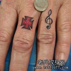 点击大图看下一张：手指十字架音符音乐纹身图片图片作品