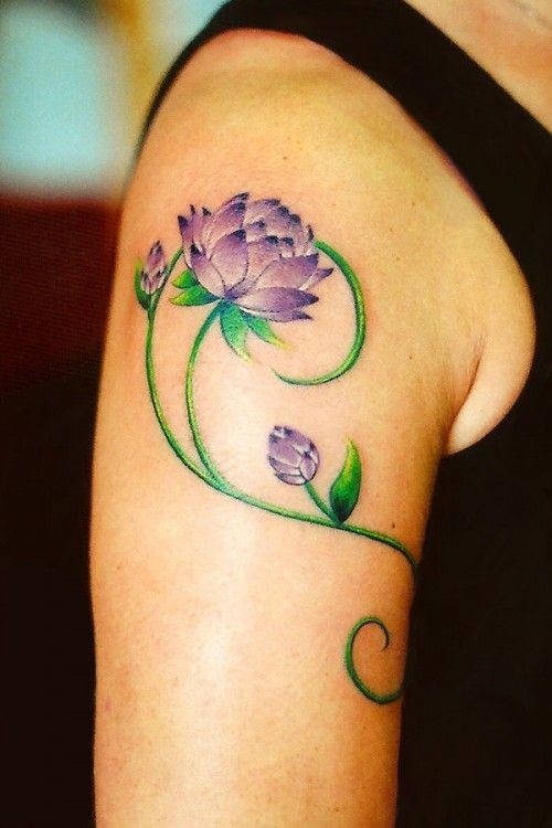 点击大图看下一张：手臂上漂亮的莲花纹身