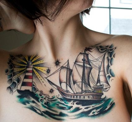 点击大图看下一张：女孩胸前海浪帆船灯塔纹身图案