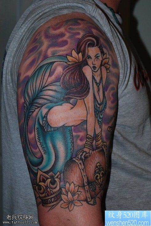 点击大图看下一张：一款大臂美人鱼纹身图案