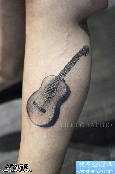 点击大图看下一张：手臂吉他纹身图案