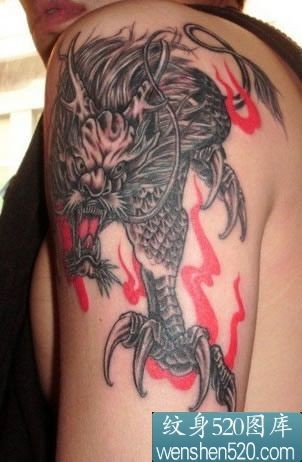点击大图看下一张：臂膀上的黑色神兽麒麟纹身图案