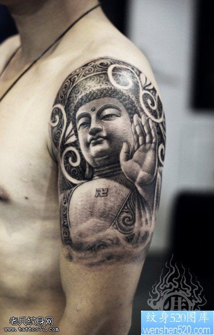 点击大图看下一张:手臂上挥手的大佛纹身图案