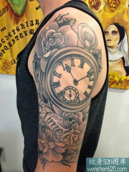 点击大图看下一张：男士手臂上记载生命的时钟纹身