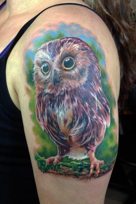 点击大图看下一张：手臂上可爱的猫头鹰纹身