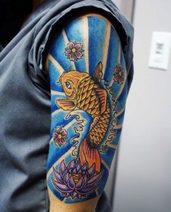 点击大图看下一张：帅气的手臂鲤鱼纹身