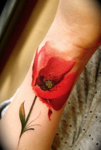 点击大图看下一张：小臂时尚的花朵纹身图2