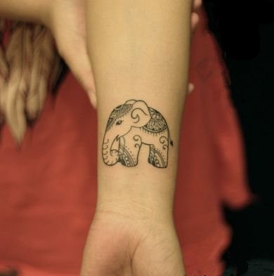 点击大图看下一张：可爱的小动物女生手臂纹身