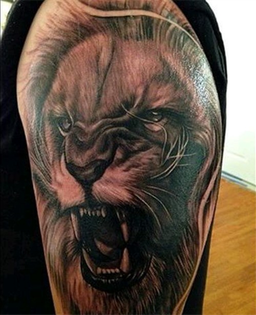 点击大图看下一张：手臂上威猛霸气的唐狮纹身图8