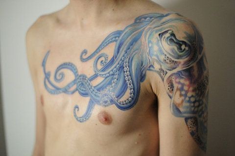 点击大图看下一张：帅气的章鱼半甲纹身