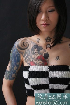 点击大图看下一张：女子半甲纹身作品