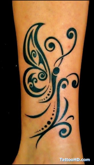 点击大图看下一张：手臂漂亮的蝴蝶图腾纹身