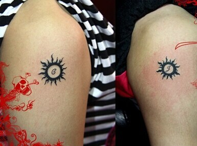 点击大图看下一张：手臂情侣图腾太阳纹身图片