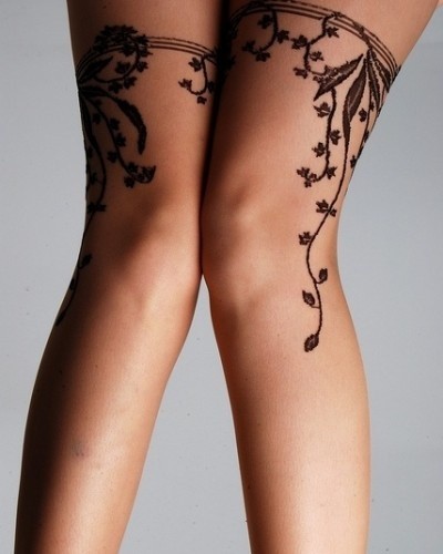 点击大图看下一张：腿部花蔓图腾纹身图案