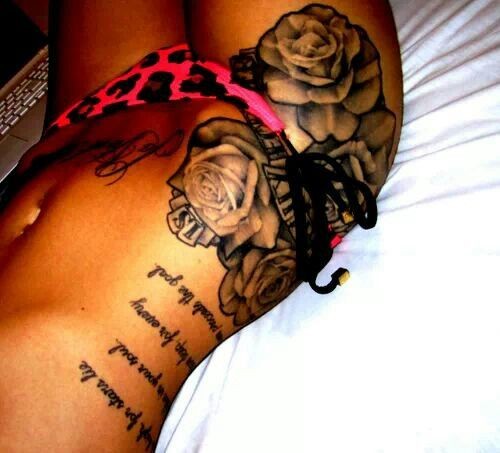 点击大图看下一张：女人腹部玫瑰英文刺青