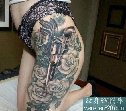 点击大图看下一张：女性腿部手枪玫瑰花纹身图案