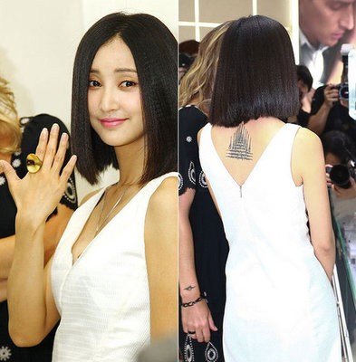 点击大图看下一张：张歆艺穿白色仙女裙子展示背部漂亮的纹身图2