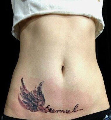 点击大图看下一张：最具诱惑力的纹身   美女腹部纹身