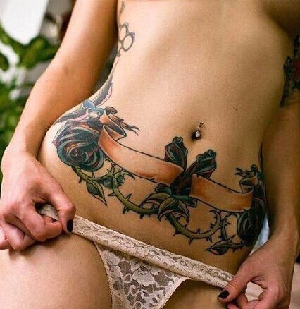 点击大图看下一张：最具性感的纹身部位  腹部纹身图2