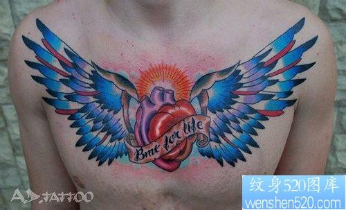 点击大图看下一张：男生前胸超酷的翅膀心脏纹身图片