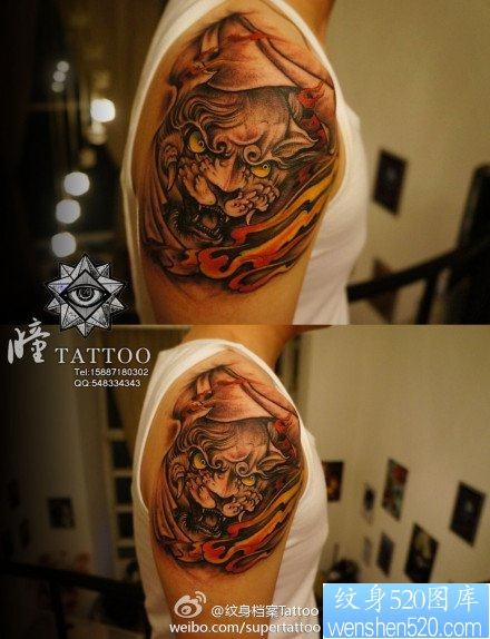 点击大图看下一张：男生手臂霸气的唐狮子纹身图片