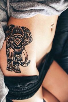 点击大图看下一张：腿部美丽漂亮的大象纹身图案