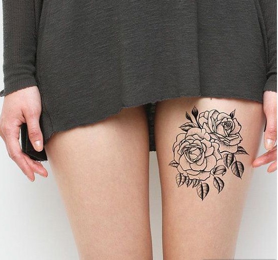 点击大图看下一张：性感女生大腿诱惑纹身