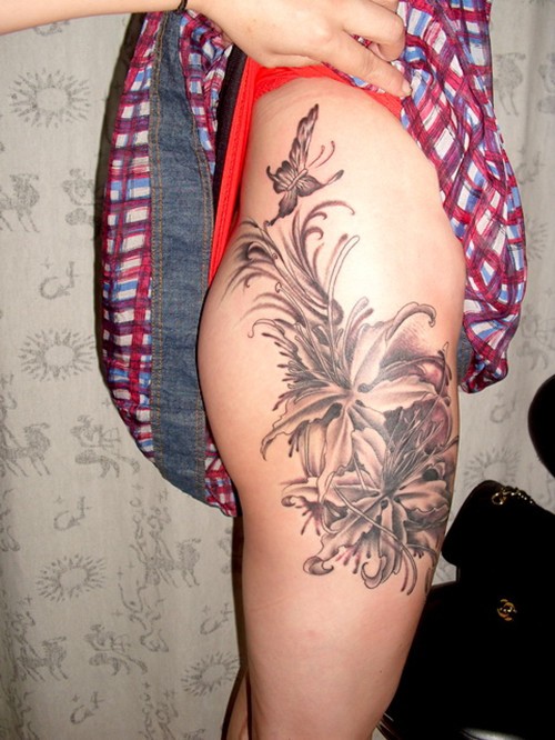 点击大图看下一张：漂亮的花朵女生大腿纹身图5