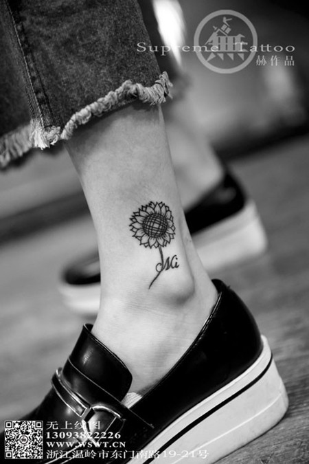 点击大图看下一张：女生向日葵小腿纹身