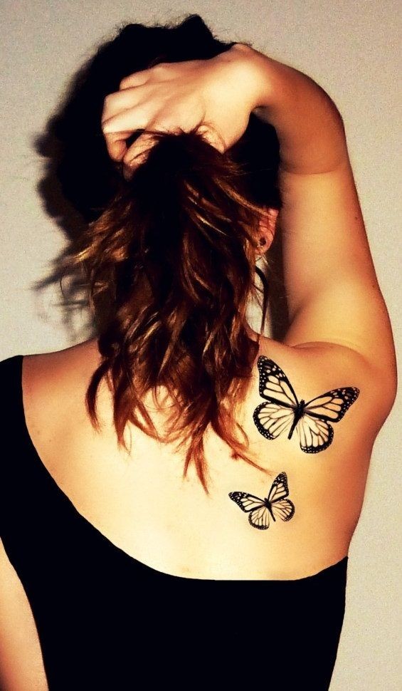 点击大图看下一张：女性背部漂亮的纹身图案