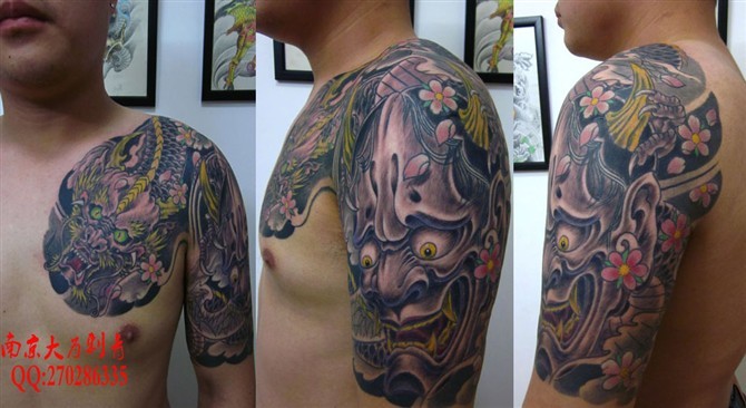 点击大图看下一张：男士霸气的半甲纹身图案