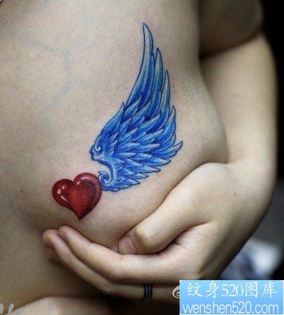 点击大图看下一张：爱心翅膀纹身图片：胸部彩色爱心翅膀纹身图片纹身作品